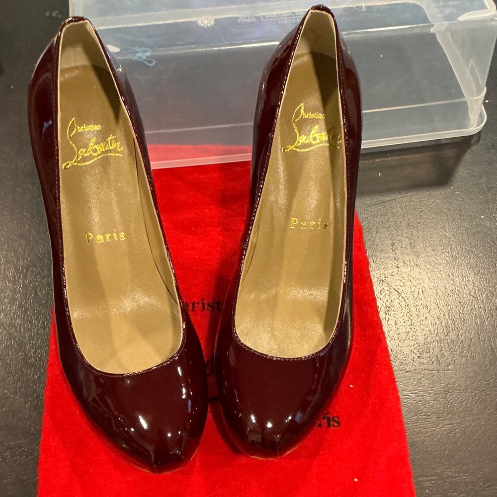 Non authentic burgundy  Heels- new - size 41. Red bottom heels